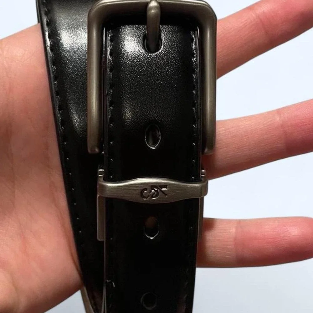 Black leather belt with silver buckle by Kemisant
